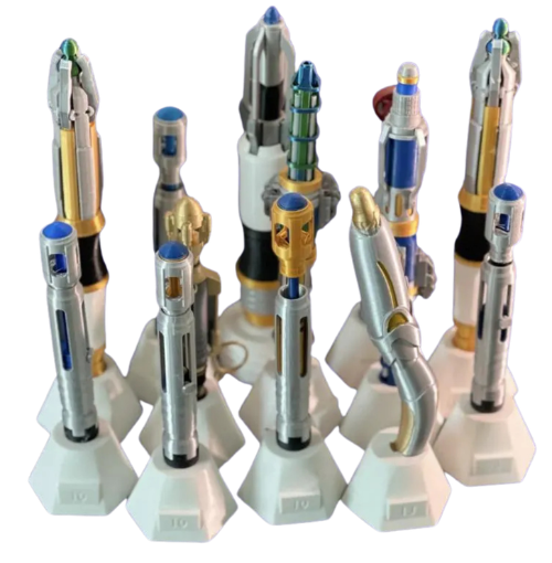 A set of toy sci-fi lightsabers with metallic silver, gold, blue, and black details, each mounted on a white display stand against a plain white background.